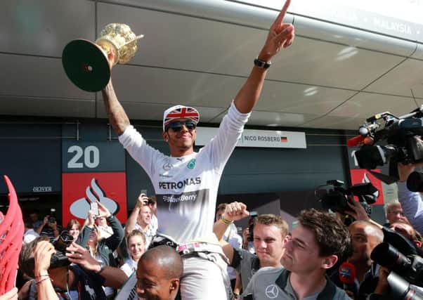 Lewis Hamilton celebrates his win at the British Grand Prix at Silverstone yesterday (Picture: David Davies/PA).