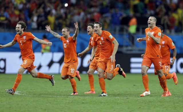 Dutch players celebrate after the Netherlands defeated Costa Rica 4-3 in a penalty shoot-out.