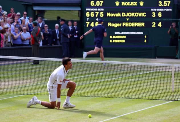 Novak Djokovic celebrates beating Roger Federer in an epic Wimbledon final.
