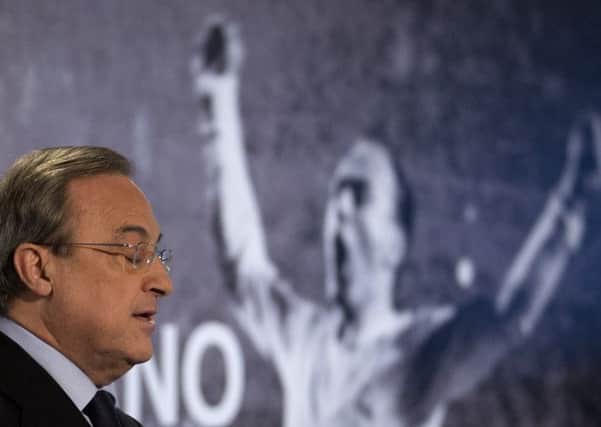 Real Madrid's President Florentino Perez makes a speech in front of a poster of Alfredo Di Stefano.