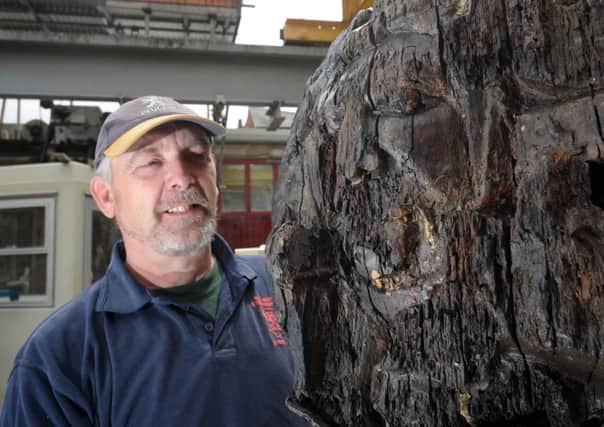 Joiner Stephen Agar pictured with burnt timber from York Minster
Picture: Simon Hulme