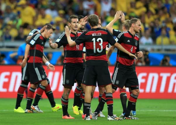 Germany's Miroslav Klose (left) celebrates scoring against Brazil.