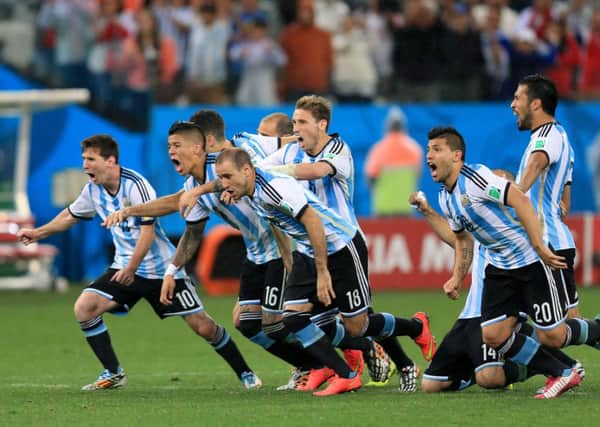 Argentina players celebrate victory in the penalty shoot-out.