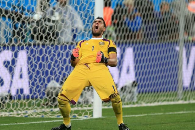 Argentina goalkeeper Sergio Romero celebrates victory in the penalty shoot-out.