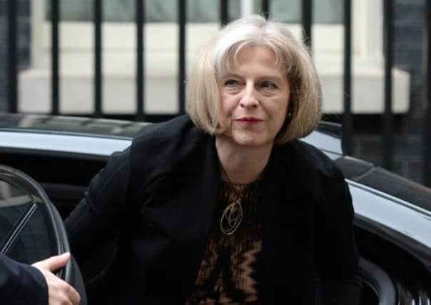 Home Secretary Theresa May arrives for a cabinet meeting at 10 Downing Street, London, after Prime Minister David Cameron confirmed that new laws are to be rushed through Parliament to allow police and MI5 to probe mobile phone and internet data.