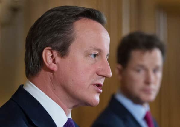 Prime Minister David Cameron and Deputy Prime Minister Nick Clegg hold a news conference at 10 Downing Street yesterday