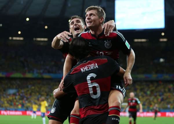 Germany's players celebrate their stunning 7-1 win over Brazil on Tuesday night.