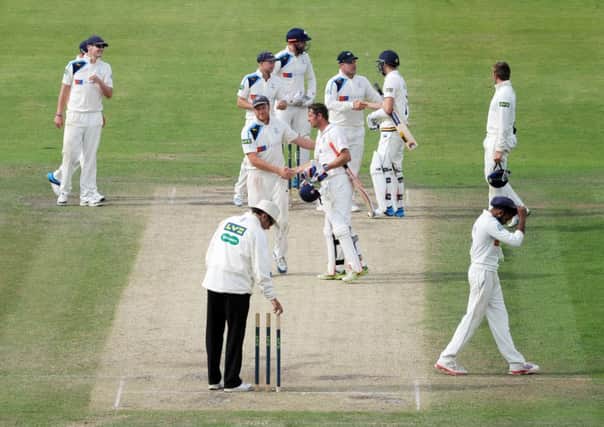 Yorkshire captain Andrew Gale shakes hands with Phil Mustard as the game ends in a draw.