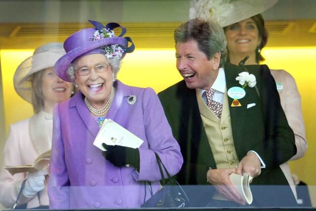 The Queen with her racing manager John Warren (Picture: Tim Ireland/PA Wire).