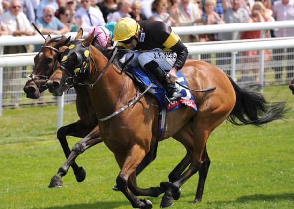 Ladies are Forever ridden by Daniel Tudhope (right) beats Joyeuse ridden by James Doyle (left) to win the Totepool Summer Stakes during the Summer Stakes Day of the 2014 John Smith's Cup Meeting at York Racecourse, York. (Picture: Anna Gowthorpe/PA Wire)