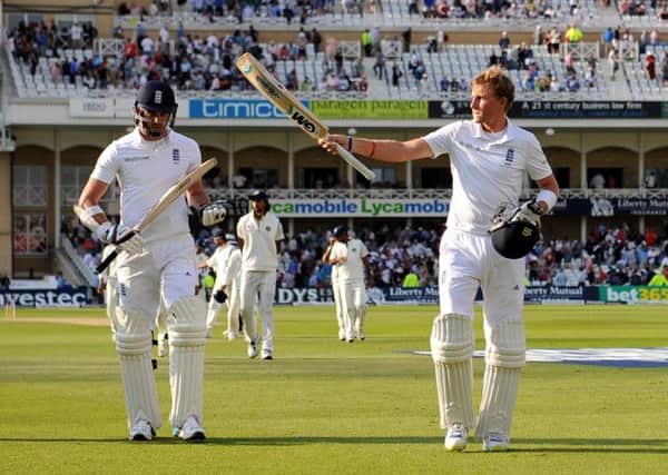 Yorkshire's Joe Root, right, salutes the Trent Bridge crowd after his patient innings for England against India.