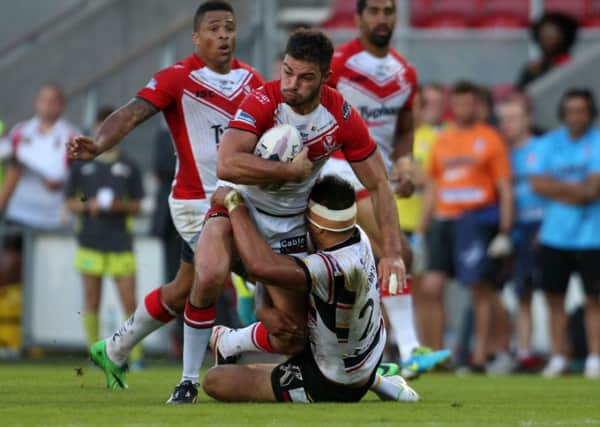 St Helens' Mark Flanagan and Bradford Bulls' Adam Henry clash during the Super League clash at Langtree Park.