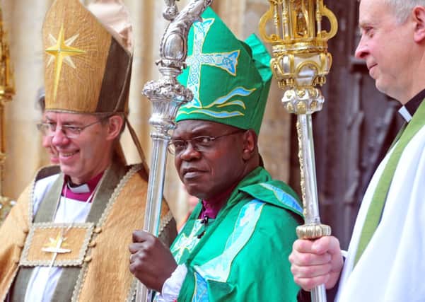 Archbishop of York John Sentamu, centre, with The Archbishop of Canterbury Justin Wilby
