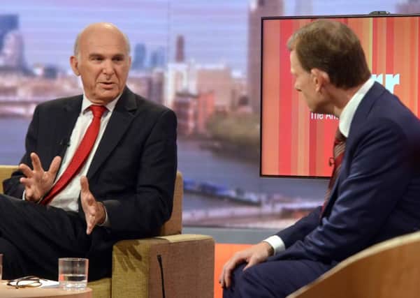 Business Secretary Vince Cable and Andrew Marr appearing on the BBC One current affairs programme, The Andrew Marr Show.