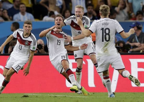 WINNERS: Germany's Mario Goetze (No 19) celebrates after scoring the winning goal against Argentina.