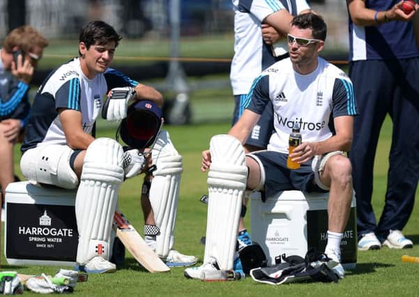 England's James Anderson (right) chats with captain Alastair Cook.