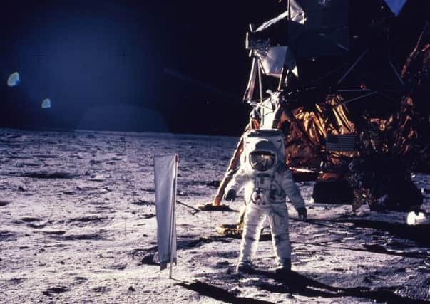 Astronaut Edwin E. Aldrin Jr. walks on the surface of the moon