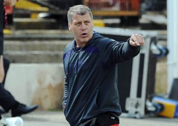 Bradford's new head coach James Lowes shouts out orders onto the pitch