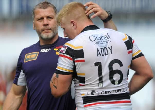 James Lowes consoles Danny Addy as they leave the field