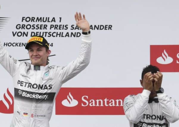 Mercedes driver Nico Rosberg, left, of Germany and Mercedes driver Lewis Hamilton, right, of Britain