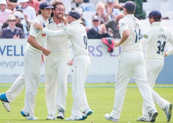 Yorkshire's Ryan Sidebottom (second left) is congratulated on the wicket of Middlesex's Chris Rodgers.