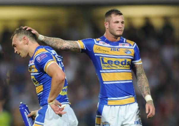 Leeds Rhinos' captain Kevin Sinfield gets a consoling pat on the head from Zak Hardaker after being sent off against Castleford Tigers (Picture: Steve Riding).