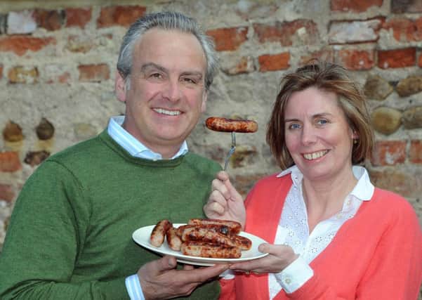Andrew and Debbie Keeble of Berryhills Farm with their Heck sausages.