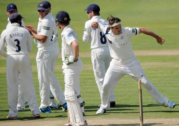 Jack Brooks celebrates as the umpires decide that Nick Gubbins was cought behind by Adam Lyth.