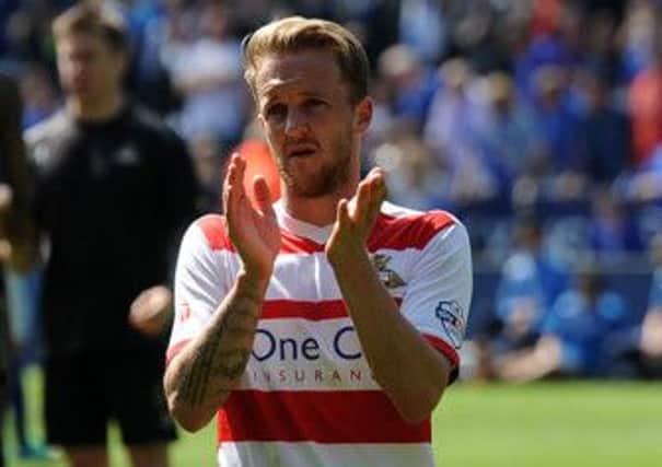 Doncaster's James Coppinger applauds Rovers fans after the club were relagated at Leicester (Picture: Andrew Roe/AHPIX LTD).