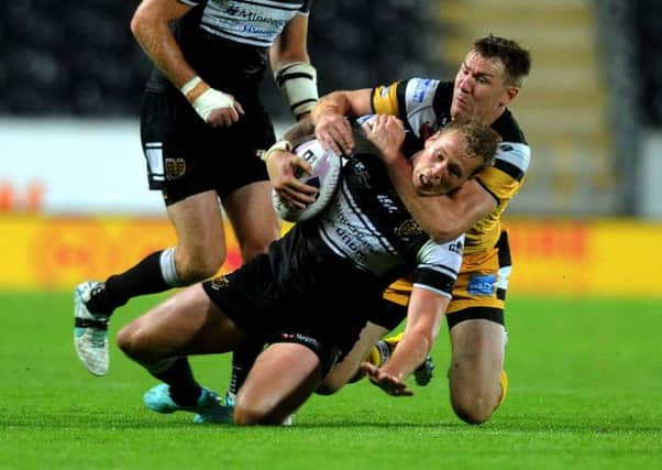 Castleford's Michael Shenton puts in a tackle on Hull's Joe Westerman. Picture: Jonathan Gawthorpe.