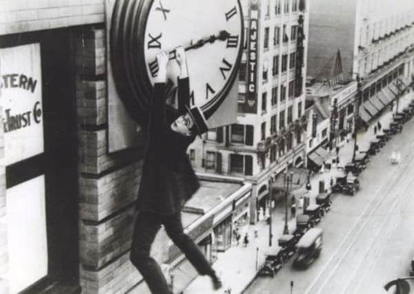 UNDER PRESSURE: England captain Alastair Cook is clinging on for dear life like Harold Lloyd dangling from the clockface in Safety Last!.
