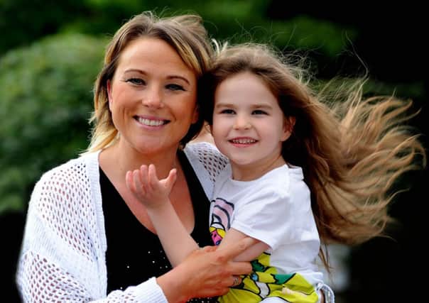 Kelly Laws with her daughter Maddie, 6. Picture by James Hardisty