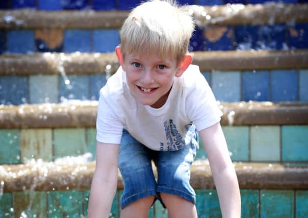 Sid Oldfield, 8, cools off in Sheffield's fountains. Picture: Ross Parry Agency