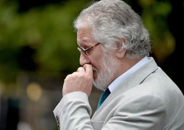 Dave Lee Travis leaves Southwark Crown Court after learning he is to face a retrial for charges of sexual assault and indecent assault