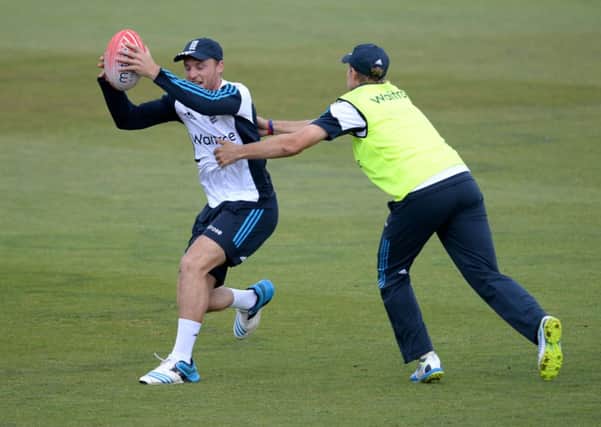 England's Jos Buttler (left) during a nets session at the Ageas Bowl.