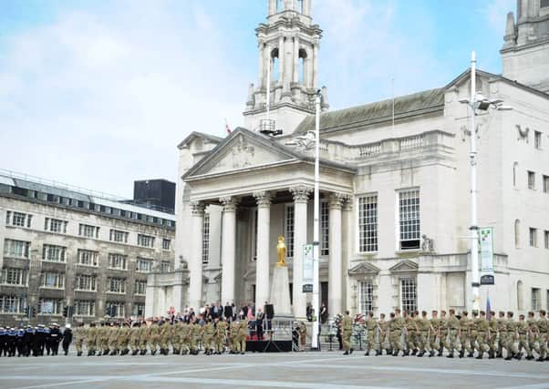 First World War commemorative parade sees service personnel march past Leeds Civic Hall on their way to Leeds Minster. Picture by Gerard Binks.