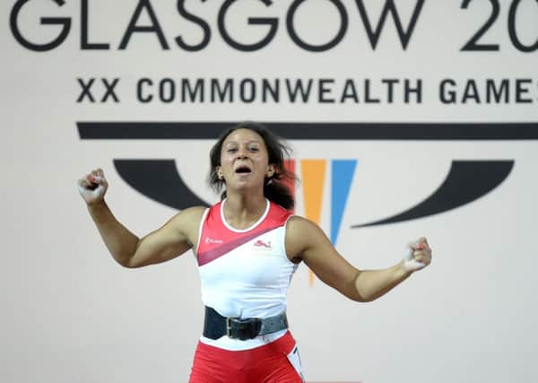 England's Zoe Smith celebrates winning the Womens 58kg Weightlifting
