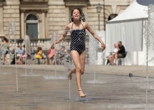 Rose Gadsby,11, from south London, playing in the water fountains
