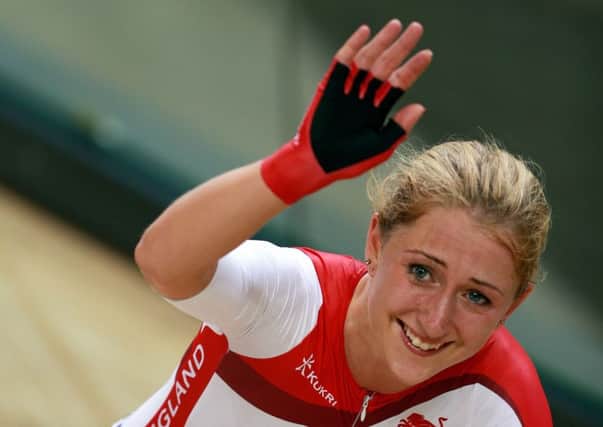 England's Laura Trott celebrates gold in the Women's Points Race at the Sir Chris Hoy Velodrome
