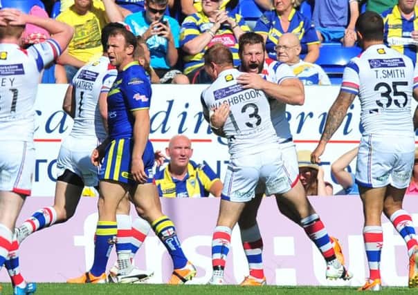 Wakefield's players celebrate their win over Warrington.