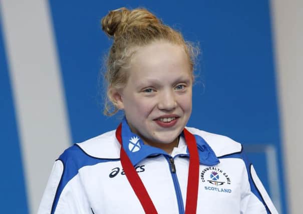 Scotland's Erraid Davies collects her bronze medal for the Women's 100m Breaststroke SB9 Final