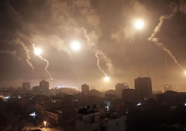 Israeli forces' flares light up the night sky of Gaza City
