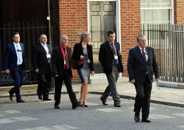 Families of Britons killed in the downing of Malaysia Airlines flight MH17 arrive  for a meeting with David Cameron.