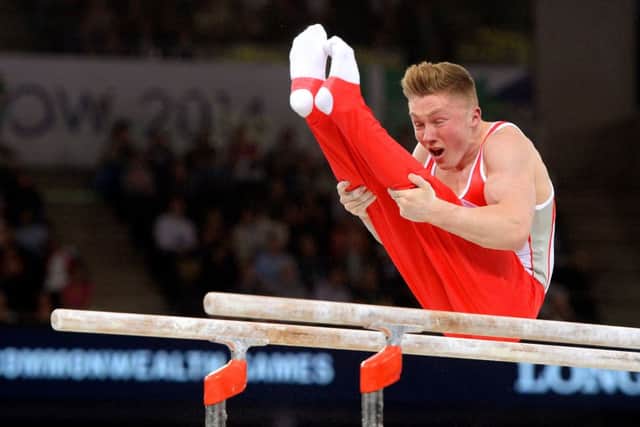 Leeds's Nile Wilson competes on the parallel bars during the all-round final