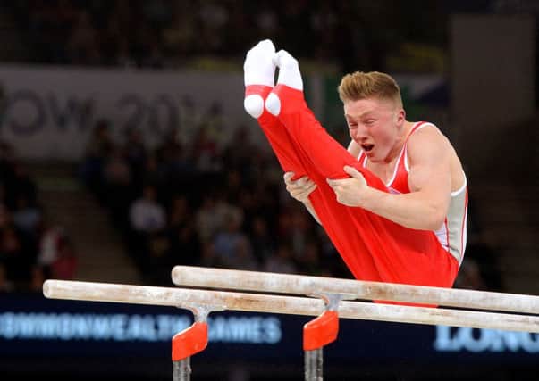 Leeds's Nile Wilson competes on the parallel bars during the all-round final