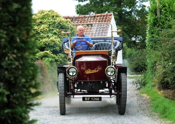 Harold Bell driving his 1908 Stanley steam car at his home near Beverley.