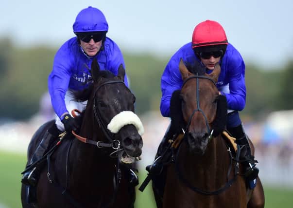 THRILLING FINISH: Cavalryman, ridden Kieren Fallon, left, romps home to win the Artemis Goodwood Cup from Ahzeemah, ridden by Harry Bentley, during day three of Glorious Goodwood.