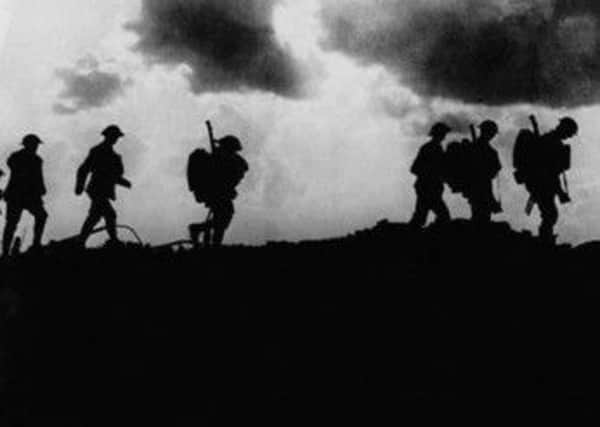 British troops in silhouette march towards trenches near Ypres