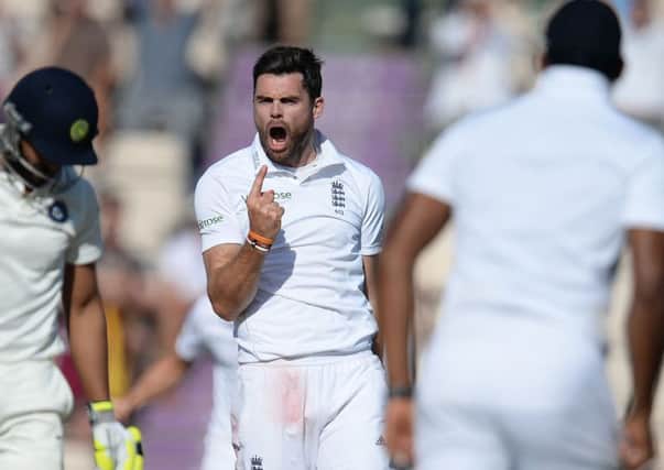 England's James Anderson (centre) celebrates taking the wicket of India's Ravindra Jadeja (left) on day three of the Third Test match at the Ageas Bowl.