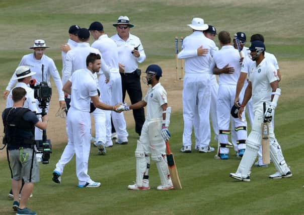 England shake hands with India's players after winning the Third Test.